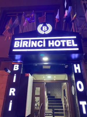a sign for a binder hotel in front of a building at Birinci Apart Hotel in Istanbul