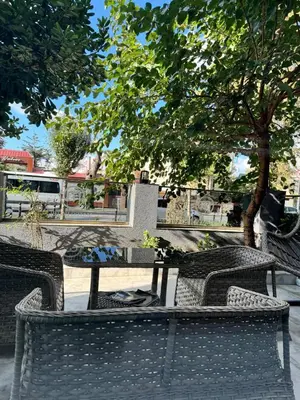 a table and chairs with a table and a tree at Mateo in Istanbul