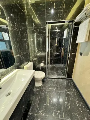 a bathroom with a toilet and a sink and a tub at Mateo in Istanbul