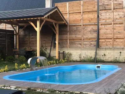 a swimming pool with a fountain in a backyard at 7Sense Nature Resort in Sapanca