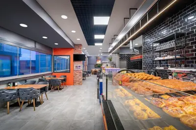 a bakery aisle with a lot of racks of pastries at Elite Port Hotel Istanbul Airport in Arnavutköy
