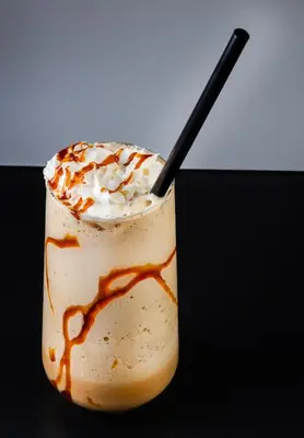 a glass of milkshake with a spoon in it at Motel Heksapolis in Tavşancıl