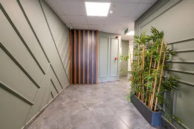 an office corridor with plants in a hallway at The Royal Luxury Hotels in Istanbul