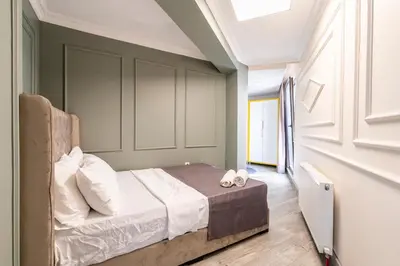 a bedroom with a bed with two towels on it at The Royal Luxury Hotels in Istanbul