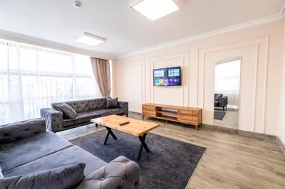 a living room with a couch and a table at The Royal Luxury Hotels in Istanbul