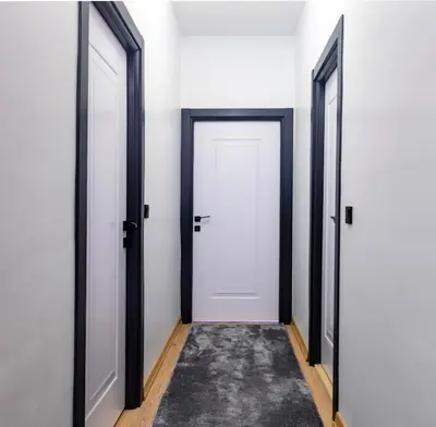 an empty corridor with two doors and a rug at Mia Mia Suites in Istanbul