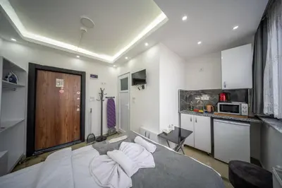 a bedroom with a bed with white pillows at Amida Family apart in Istanbul