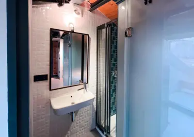 a bathroom with a sink and a mirror at Homie Suites - ''Loft 27'' Urban Comfort Suites in the Heart of Cihangir in Istanbul