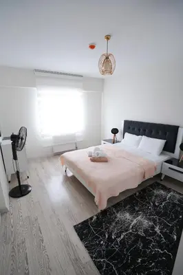 a bedroom with a large bed and a window at King Suite SA2 in Esenyurt
