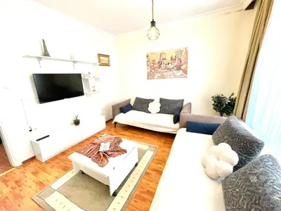 a living room with a couch and a tv at Best house for family in Istanbul