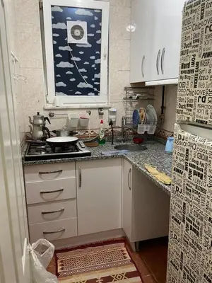 a kitchen with a sink and a stove and a window at Best house for family in Istanbul
