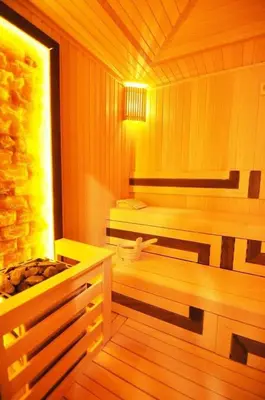a sauna with a bench and a tub in it at Gorgeous Bright Studio Parking PoolViews! #135 in Istanbul
