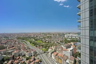 an aerial view of a city with a tall building at Cool Airy Modern 2bd2bath Parkingpoolgym! #219 in Istanbul