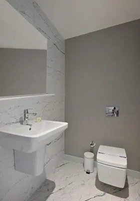 a white bathroom with a sink and a toilet at Bright Lovely Modern 2BD25 Condo PoolGym! #220 in Istanbul