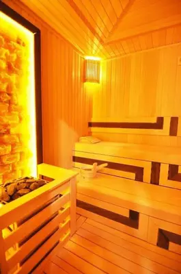a sauna with a bench and a tub in it at Beautiful Modern 1BD Condo Views w PoolGym! #223 in Istanbul