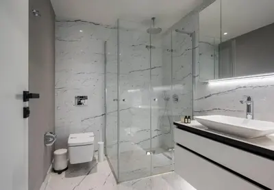 a bathroom with a glass shower and a sink at Lovely Modern 1BD Condo Views w PoolGym! #222 in Istanbul