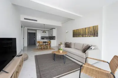 a living room with a couch and a table at Lovely Modern 1BD Condo Views w PoolGym! #222 in Istanbul