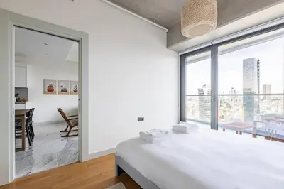 a bedroom with a bed and a large window at Gorgeous Modern 1BD Terrace CondoPoolViews! #233 in Istanbul