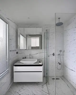 a white bathroom with a sink and a shower at Cozy Bright Studio w Parking, PoolViews! #237 in Istanbul