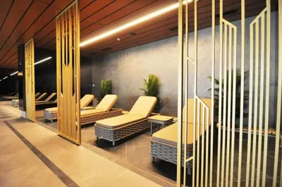 a waiting area with chairs and tables in a building at Cozy Bright Studio w Parking, PoolViews! #237 in Istanbul