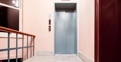 a hallway with a glass door in a building at Homie Suites - Turna Residences in Cihangir in Istanbul