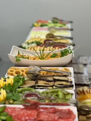 a row of plates of food on a table at White Palace Haliç in Istanbul