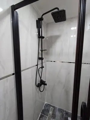 a shower with a shower head in a bathroom at White Palace Haliç in Istanbul