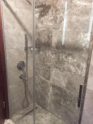 a shower with a glass door in a bathroom at Inera Hotel Pendik in Istanbul