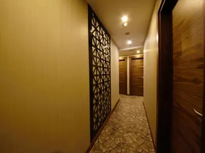 a hallway with a door and a tile floor at Inera Hotel Pendik in Istanbul