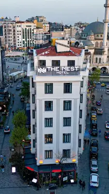 a white building with a red roof in a city at THE NEST HOTEL in Istanbul