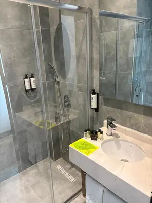 a bathroom with a shower and a sink at Business Life Hotel Güneşli in Istanbul