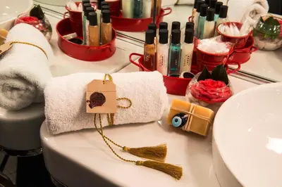 a bathroom counter with a towel and a sink at Sura Hagia Sophia Hotel in Istanbul