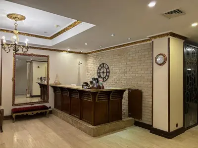 a bathroom with a vanity and a mirror at Nil Hotel İstanbul City Center in Istanbul