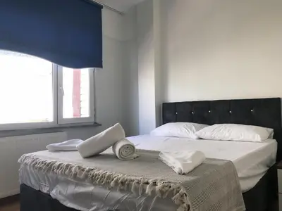 a bed with two towels and two hats on it at Apartment sultanahmet in Istanbul