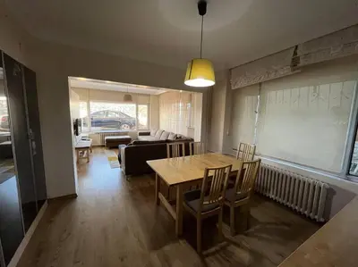 a living room with a table and a couch at Bosphorus waterfront flat, Cengelköy in Istanbul