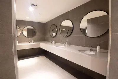 a bathroom with three sinks and three mirrors at Park Inn by Radisson Yalova City Center in Yalova