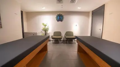 a waiting room with two chairs and a table at Park Inn by Radisson Yalova City Center in Yalova