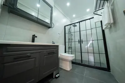a bathroom with a toilet and a sink and a shower at Solomon's Mansion Hotel Istanbul in Istanbul