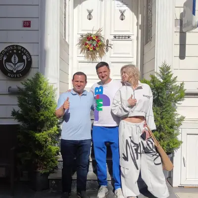 a group of people standing in front of a house at Solomon's Mansion Hotel Istanbul in Istanbul