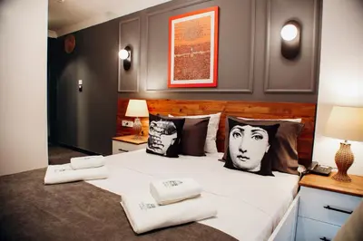 a bedroom with a large bed with towels on it at Istiklal Street Taksim House Yamalya Hotel in Istanbul