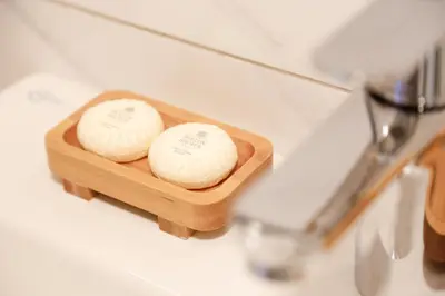 two cakes in a wooden dish on a counter at Istiklal Street Taksim House Yamalya Hotel in Istanbul