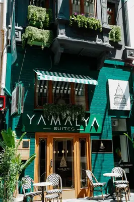 a restaurant with tables and chairs in front of a building at Istiklal Street Taksim House Yamalya Hotel in Istanbul