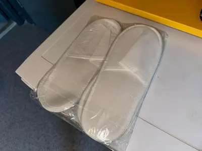 a pair of shoes in a box on the floor at Aderans Hotel in Istanbul
