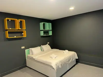 a bedroom with a bed with two towels on it at Aderans Hotel in Istanbul