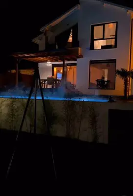 a house at night with a pool in front of it at Nefes Vılla Sapanca in Sakarya