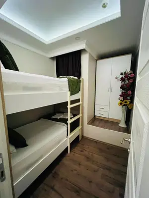 a small room with bunk beds and a mirror at Bona apart in Istanbul