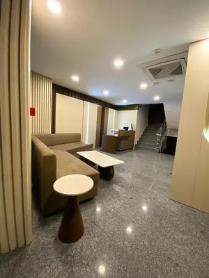 a living room with a couch and a table and stairs at Joy Taksim in Istanbul