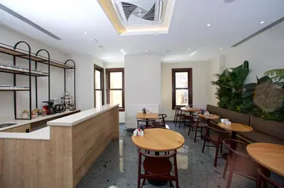 a restaurant with tables and chairs in a room at Joy Taksim in Istanbul