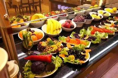 a buffet line with a variety of fruits and vegetables at Grand Bazaar Hotel in Istanbul