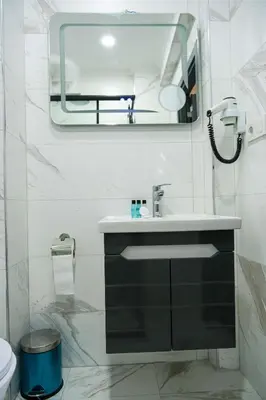 a bathroom with a sink and a mirror at hotel La Vitrine in Istanbul